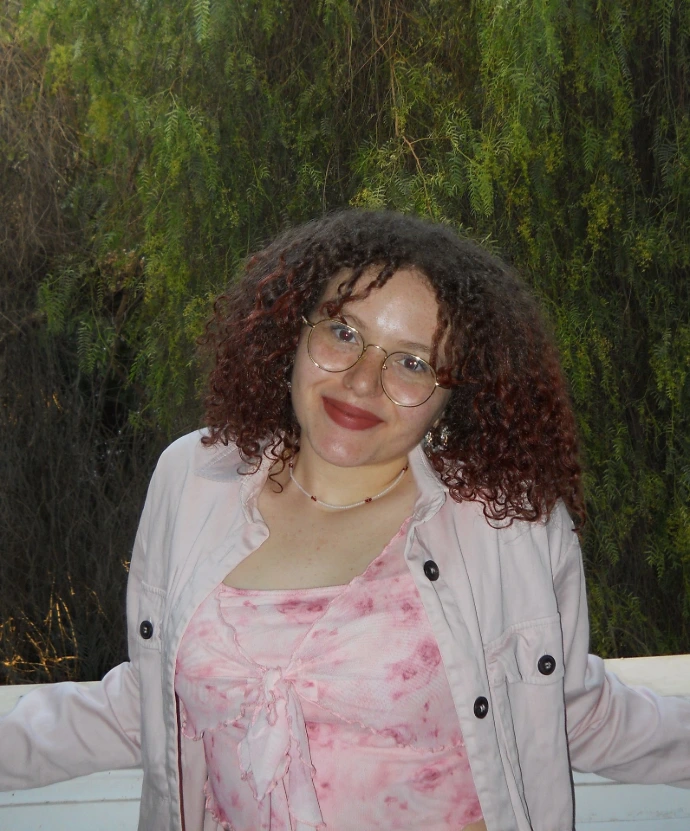 The marketing intern posing for a professional photo