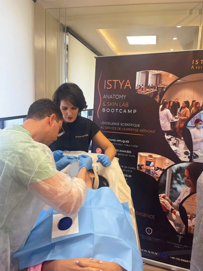 Healthcare professional performing a facial injection technique on a real model