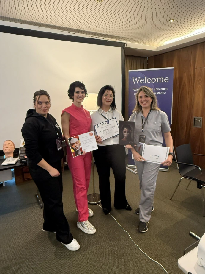 Doctors practicing aesthetic injection techniques during an advanced medical education workshop